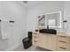 Stylish powder room features a sleek black vessel sink and modern lighting at 8717 Kingship Ct, Las Vegas, NV 89129