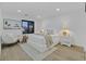 Inviting bedroom featuring a large bed, ample lighting, and modern furnishings at 8717 Kingship Ct, Las Vegas, NV 89129