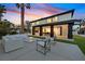 Rear exterior of home showcasing outdoor living area, patio, and landscaped backyard at 8717 Kingship Ct, Las Vegas, NV 89129