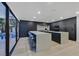 A bright kitchen with high end appliances, two islands, and access to the pool area at 8717 Kingship Ct, Las Vegas, NV 89129