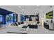 Bright open-plan living room features a black accent wall and seamless access to outdoor area at 8717 Kingship Ct, Las Vegas, NV 89129