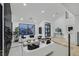 Spacious living room with sleek furnishings, large windows, and modern decor at 8717 Kingship Ct, Las Vegas, NV 89129