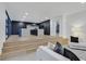 Open floor plan with living room connected to the kitchen, wood flooring at 8717 Kingship Ct, Las Vegas, NV 89129
