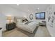 Bright main bedroom with modern furnishings, large window, and stylish decor at 8717 Kingship Ct, Las Vegas, NV 89129