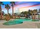 Inviting pool area with spa, sun loungers, lush landscaping, and relaxing ambiance at 8717 Kingship Ct, Las Vegas, NV 89129