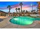 Stunning backyard pool area with sun loungers, a spa, and meticulous landscaping at 8717 Kingship Ct, Las Vegas, NV 89129