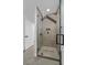 Modern tiled shower with glass door and black hardware for a spa-like experience at 8717 Kingship Ct, Las Vegas, NV 89129
