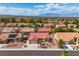 This aerial view showcases a single Gathering home with red tile roof, desert landscaping, and mountain views at 8812 Stoney Point Dr, Las Vegas, NV 89134