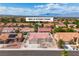 Aerial view of a single Gathering home with red tile roof, desert landscaping, and community view at 8812 Stoney Point Dr, Las Vegas, NV 89134