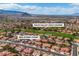 Aerial shot of a neighborhood near the Palm Valley Golf Course, set against a scenic mountain backdrop at 8812 Stoney Point Dr, Las Vegas, NV 89134