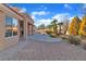 Well maintained backyard with mature trees, rock features, and drought resistant landscaping, offering a tranquil retreat at 8812 Stoney Point Dr, Las Vegas, NV 89134