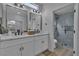Bathroom features a double vanity and walk-in shower at 8812 Stoney Point Dr, Las Vegas, NV 89134