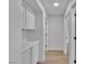 Bright hallway with wood floors, and white cabinets at 8812 Stoney Point Dr, Las Vegas, NV 89134