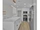 Modern kitchen featuring a center island, stainless appliances, and sleek white cabinetry at 8812 Stoney Point Dr, Las Vegas, NV 89134