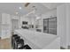 Modern kitchen featuring white cabinets, stainless steel appliances, and a large marble island with bar stools at 8812 Stoney Point Dr, Las Vegas, NV 89134