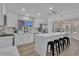 Bright kitchen features a waterfall island, stainless steel appliances, and wood flooring at 8812 Stoney Point Dr, Las Vegas, NV 89134