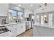 Bright kitchen showcases an island, modern appliances, and white cabinets at 8812 Stoney Point Dr, Las Vegas, NV 89134