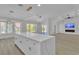 Open concept living room features wood floors, and vaulted ceilings at 8812 Stoney Point Dr, Las Vegas, NV 89134