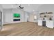 Spacious living room features modern fireplace, wet bar, vaulted ceiling and beautiful flooring at 8812 Stoney Point Dr, Las Vegas, NV 89134