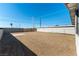 Spacious backyard gravel-covered, offering a versatile outdoor space at 887 W Carey Ave, North Las Vegas, NV 89030