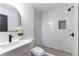 Bright bathroom featuring marble tiling in shower, modern vanity, and elegant finishes at 887 W Carey Ave, North Las Vegas, NV 89030