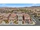 Expansive aerial view of a residential neighborhood with desert landscaping and mountain views at 922 Harbor Ave, Henderson, NV 89002
