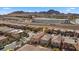 Aerial view of residential homes near commercial areas and mountain range in the distance at 922 Harbor Ave, Henderson, NV 89002