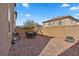 A serene backyard boasts a spacious patio area with an outdoor dining set, perfect for enjoying outdoor meals and relaxation at 922 Harbor Ave, Henderson, NV 89002