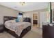 Bedroom featuring a cozy bed, modern furnishings, and soft lighting, creating a relaxing atmosphere for restful nights at 922 Harbor Ave, Henderson, NV 89002