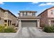 Inviting two-story home with a spacious driveway and well-maintained landscaping at 922 Harbor Ave, Henderson, NV 89002