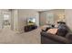 Comfortable living room featuring a gray sectional sofa, TV, and plush accents at 922 Harbor Ave, Henderson, NV 89002