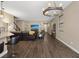 Open floor plan showcases wood floors and the transition from kitchen to living room and dining areas at 922 Harbor Ave, Henderson, NV 89002