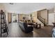 Open-concept living room with wood floors, modern furniture, and access to the backyard at 922 Harbor Ave, Henderson, NV 89002