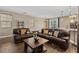 Spacious living room showcases leather furniture, wood floors, and contemporary decor, perfect for relaxation at 922 Harbor Ave, Henderson, NV 89002