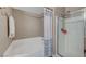 Bright bathroom with a soaking tub, glass-enclosed shower, and neutral wall tones at 10001 Peace Way # 1321, Las Vegas, NV 89147