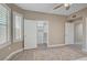 This bedroom features a ceiling fan, wood floors, and a closet with shelving at 10001 Peace Way # 1321, Las Vegas, NV 89147