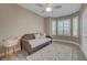 Cozy bedroom featuring a daybed, ceiling fan, and bright natural light from the windows at 10001 Peace Way # 1321, Las Vegas, NV 89147
