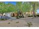 Beautifully landscaped exterior with mature trees, manicured shrubs, and inviting pathways, creating curb appeal at 10001 Peace Way # 1321, Las Vegas, NV 89147