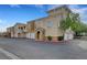Attractive townhome showcasing modern architecture, garage, and well-maintained landscaping at 10001 Peace Way # 1321, Las Vegas, NV 89147