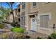 Charming townhome showcasing an inviting entrance, well-maintained landscaping, and a welcoming facade at 10001 Peace Way # 1321, Las Vegas, NV 89147