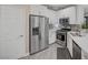 Modern kitchen with stainless steel appliances, white cabinets, and stylish backsplash at 10001 Peace Way # 1321, Las Vegas, NV 89147