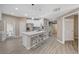 Modern kitchen with breakfast bar seating, white cabinets, and hardwood floors at 10001 Peace Way # 1321, Las Vegas, NV 89147