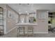 Inviting kitchen features a breakfast bar with seating, modern appliances, and lots of natural light at 10001 Peace Way # 1321, Las Vegas, NV 89147