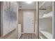 Functional laundry area with washer, dryer, and convenient shelving for storage at 10001 Peace Way # 1321, Las Vegas, NV 89147