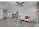 Spacious open-concept living area with modern decor, a stylish sofa, and sleek flooring, ideal for entertaining at 10001 Peace Way # 1321, Las Vegas, NV 89147