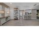 Open-concept living room with modern decor flowing into the kitchen and dining area at 10001 Peace Way # 1321, Las Vegas, NV 89147