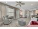 Open living room with modern floors, neutral walls, stylish furniture, and lots of natural light at 10001 Peace Way # 1321, Las Vegas, NV 89147