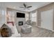 Cozy living room with a fireplace, ceiling fan, and lots of natural light at 10001 Peace Way # 1321, Las Vegas, NV 89147
