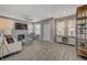 Bright living room with wood floors, fireplace, large TV, and lots of natural light at 10001 Peace Way # 1321, Las Vegas, NV 89147