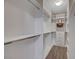 Well-organized walk-in closet with built-in shelving and ample storage space at 10001 Peace Way # 1321, Las Vegas, NV 89147